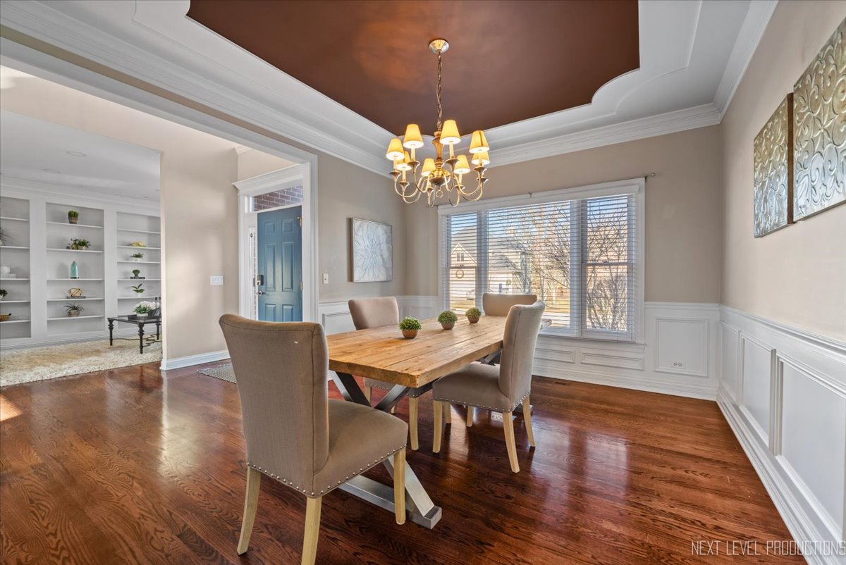2197 Red Maple Lane Aurora, IL 60502 - Photo 40 of 48 a view of a dining room with furniture wooden floor and chandelier