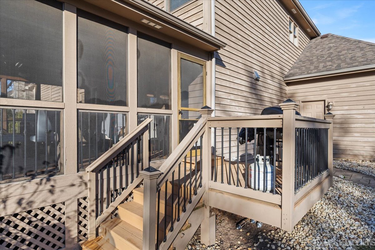 2197 Red Maple Lane Aurora, IL 60502 - Photo 43 of 48 a view of a balcony with wooden floor and fence