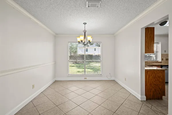 a view of a kitchen with a dishwasher cabinets and a wooden floor