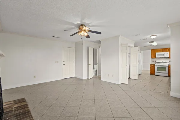 a view of a big room with closet and windows