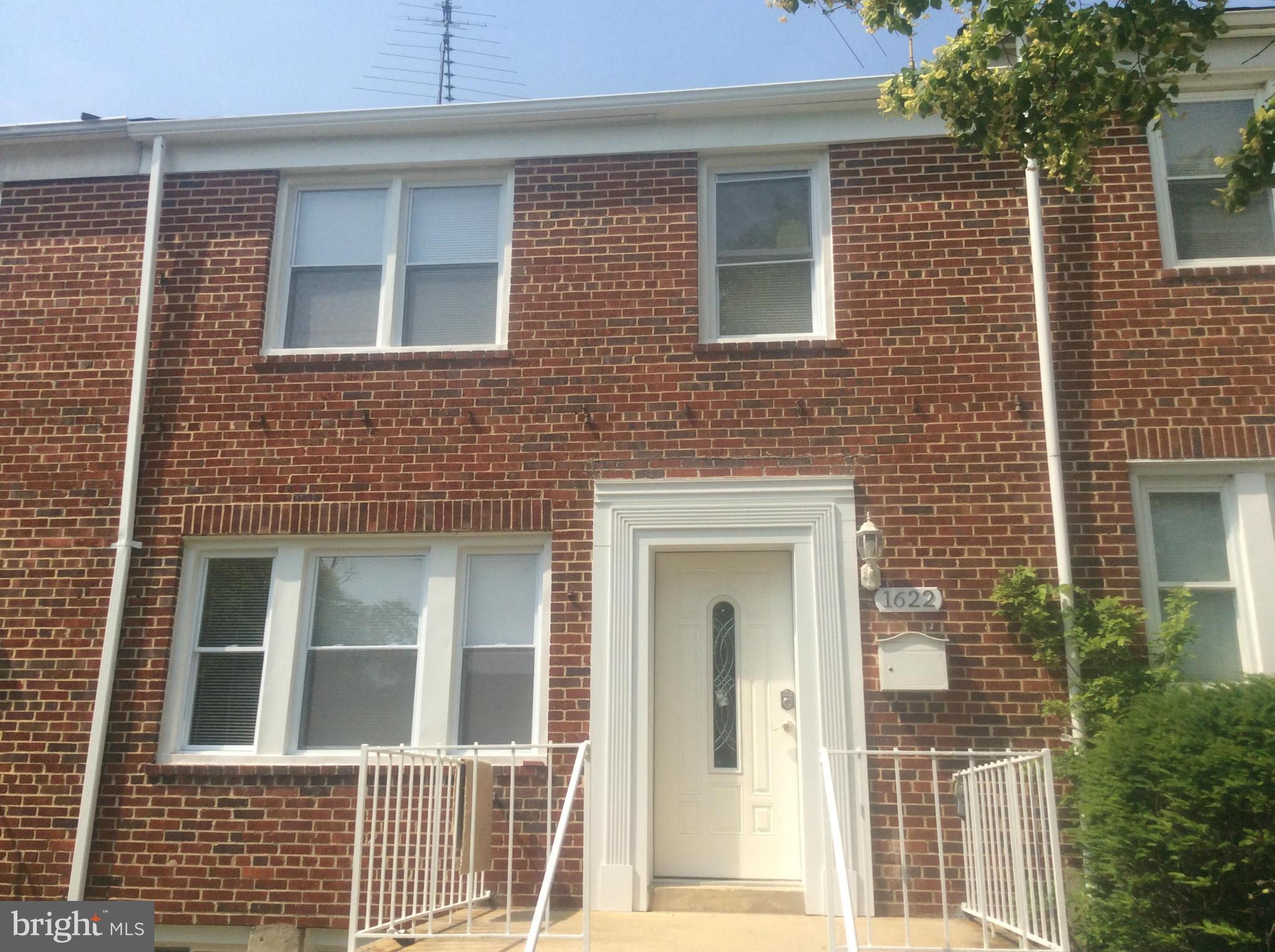 1622 Ingram Road Baltimore, MD 21239 - Photo 1 of 1 a view of a brick house with a window
