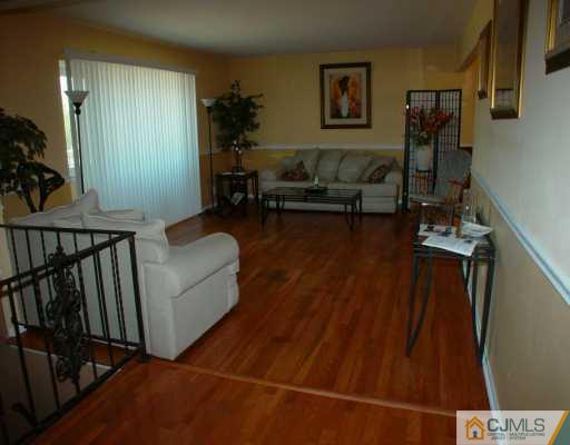 17 Conerly Road Somerset, NJ 08873 - Photo 5 of 6 a living room with furniture and wooden floor