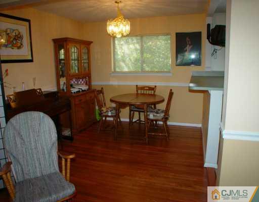 17 Conerly Road Somerset, NJ 08873 - Photo 6 of 6 a view of a dining room with furniture and chandelier