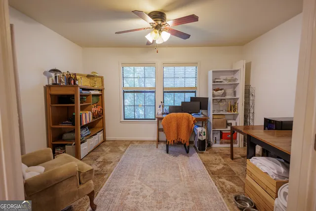 a bedroom with furniture and a window