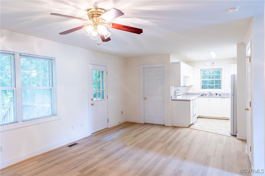 3908 Broad St Road Gum Spring, VA 23065 - Photo 10 of 26 a view of a kitchen with a microwave and wooden floor