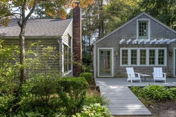 a front view of a house with garden