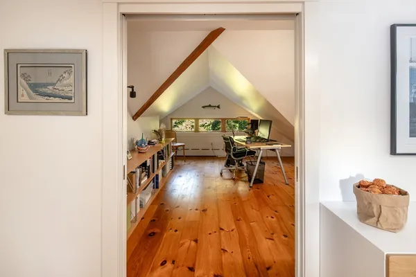 a view of a hallway with seating area