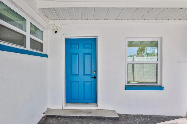 a view of a big room with wooden floors and a fireplace