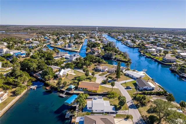 an aerial view of a house with a swimming pool