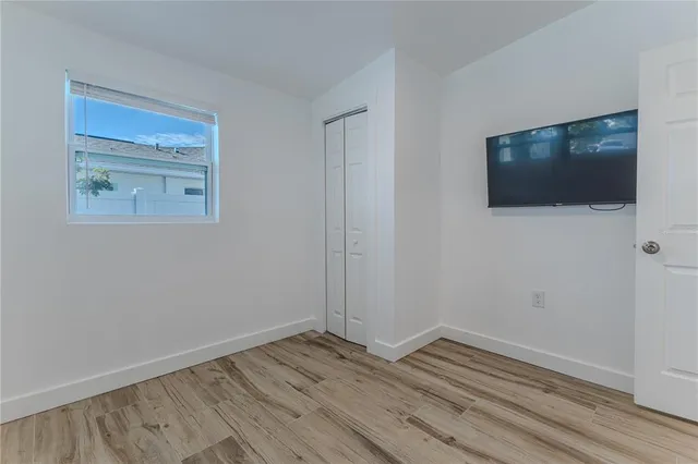 a view of a chairs and table in patio