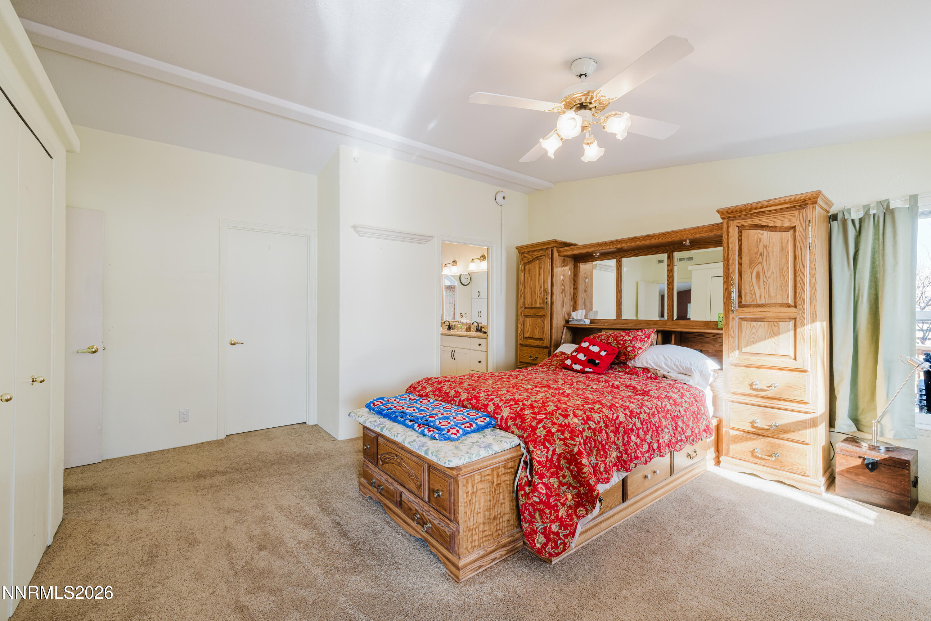 2013 Blume Ranch Road Lamoille, NV 89828 - Photo 20 of 37 a bedroom with a bed and a chandelier