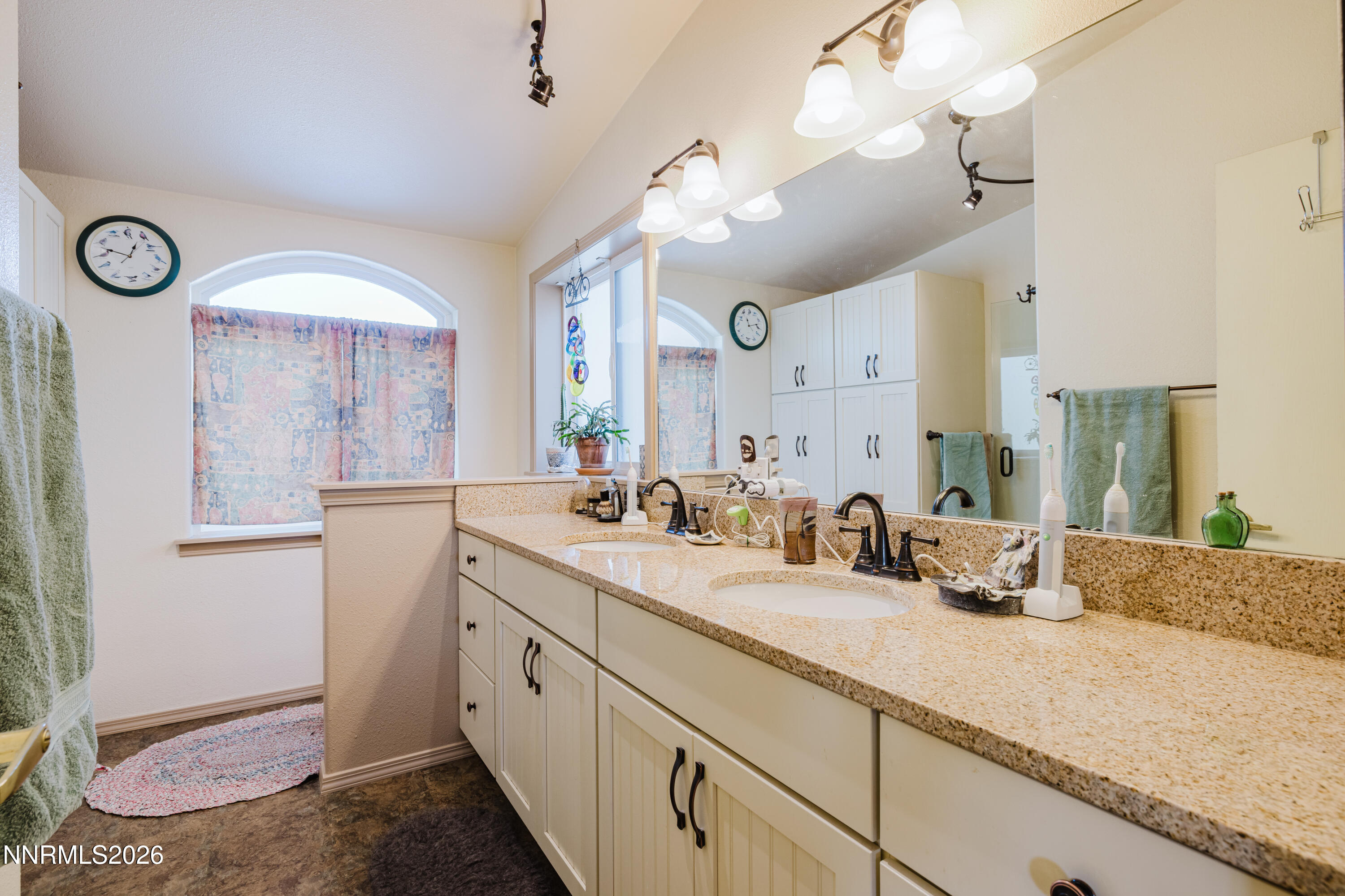 2013 Blume Ranch Road Lamoille, NV 89828 - Photo 21 of 37 a spacious bathroom with a granite countertop sink mirror and vanity