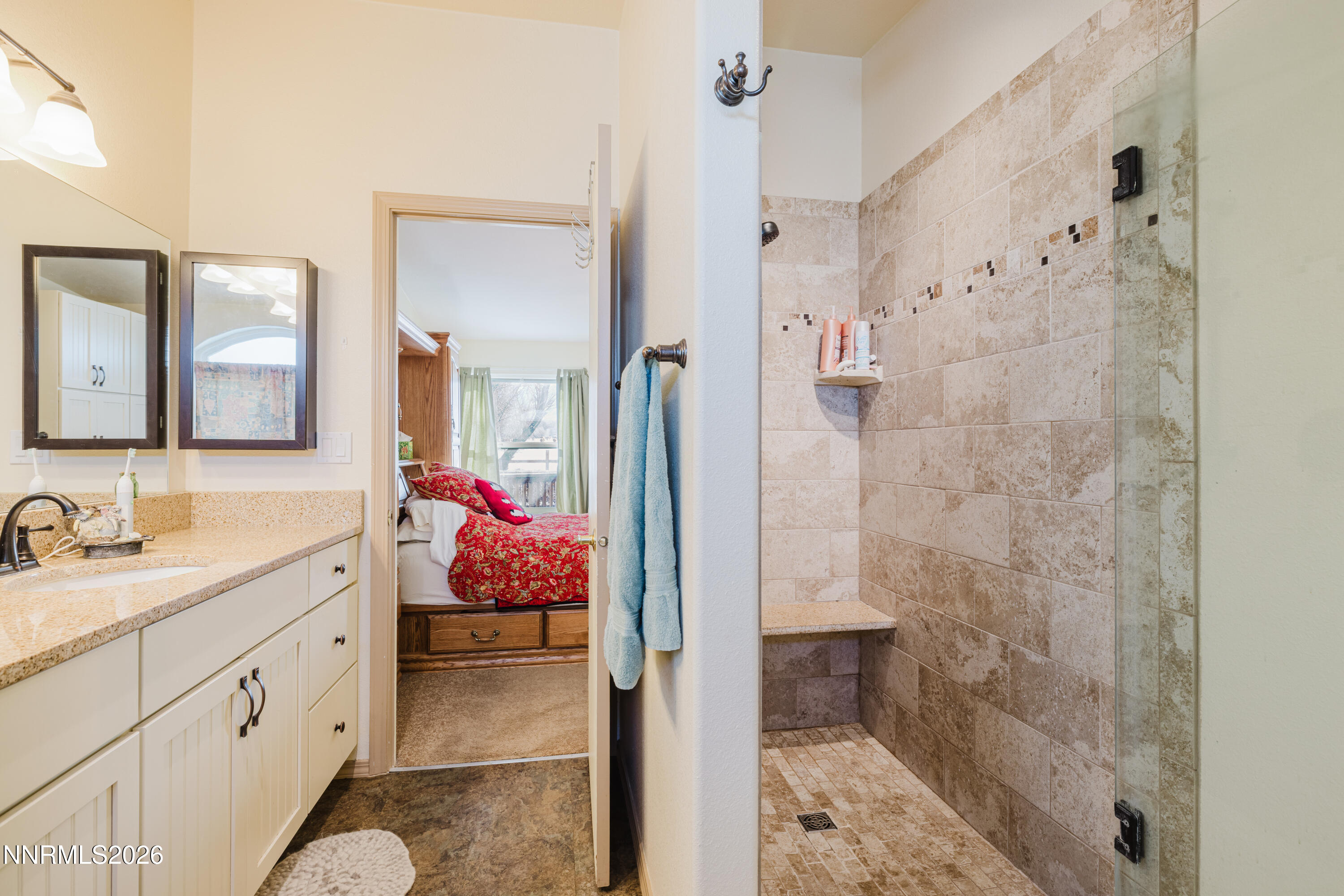 2013 Blume Ranch Road Lamoille, NV 89828 - Photo 22 of 37 a bathroom with a sink mirror and shower
