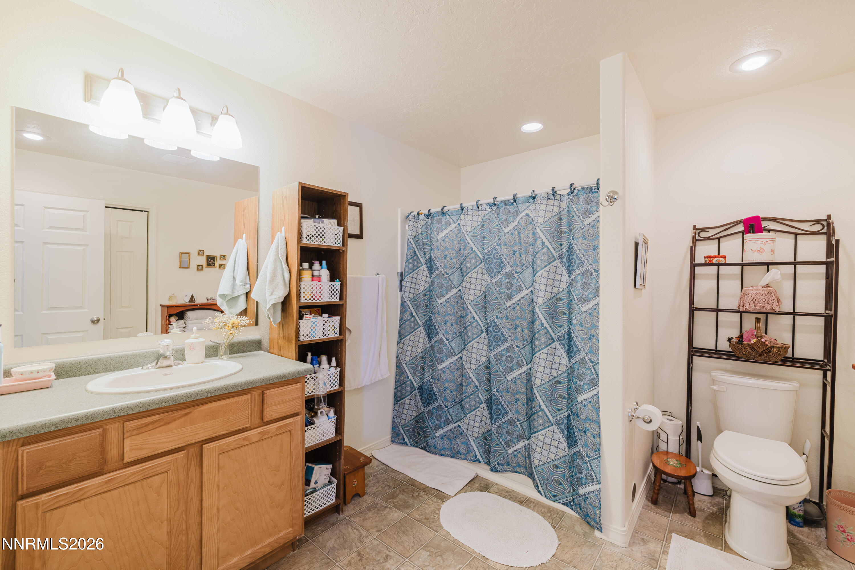 2013 Blume Ranch Road Lamoille, NV 89828 - Photo 30 of 37 a bathroom with a sink toilet vanity and shower