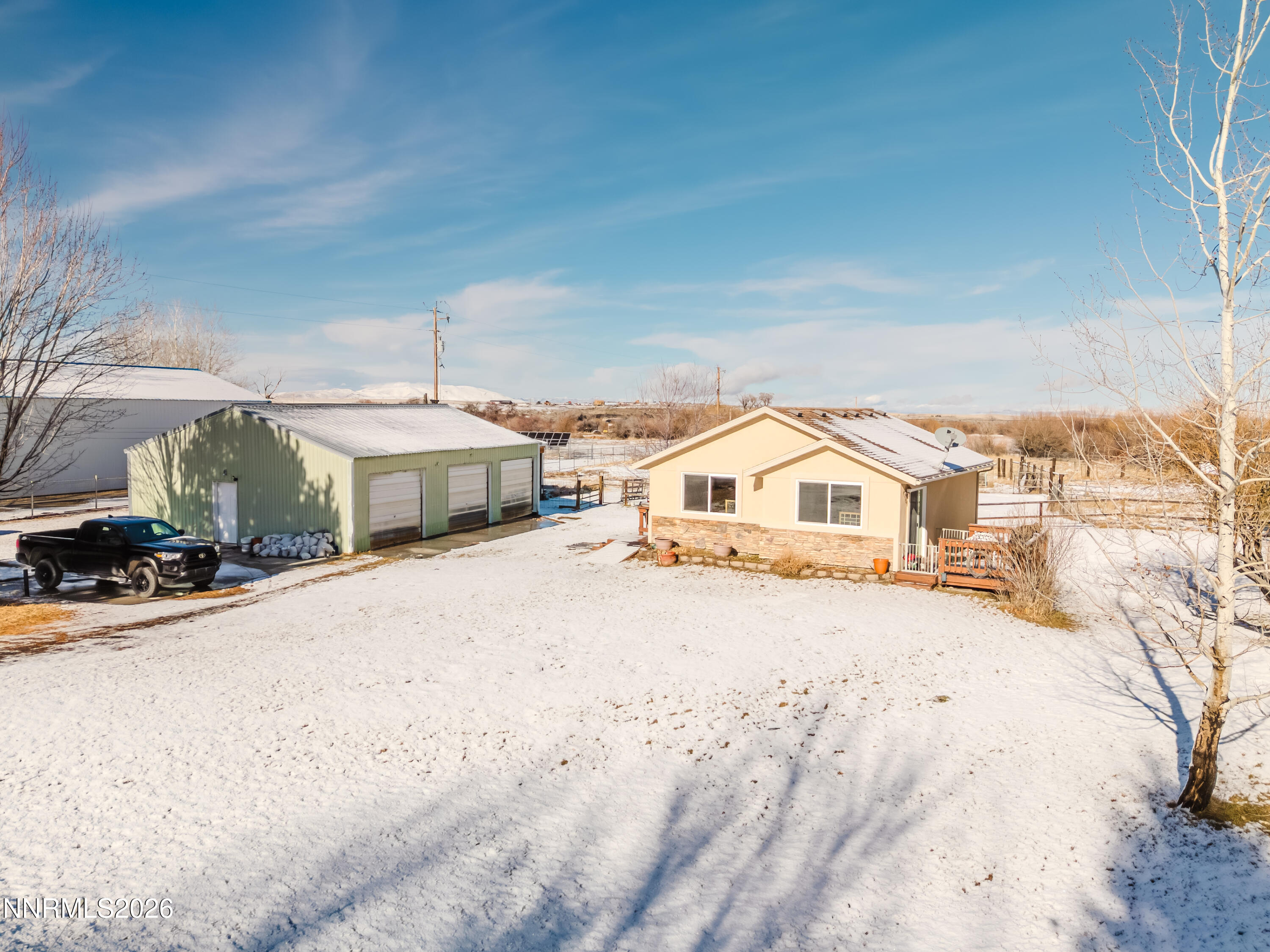 2013 Blume Ranch Road Lamoille, NV 89828 - Photo 5 of 37 a front view of a house with a yard