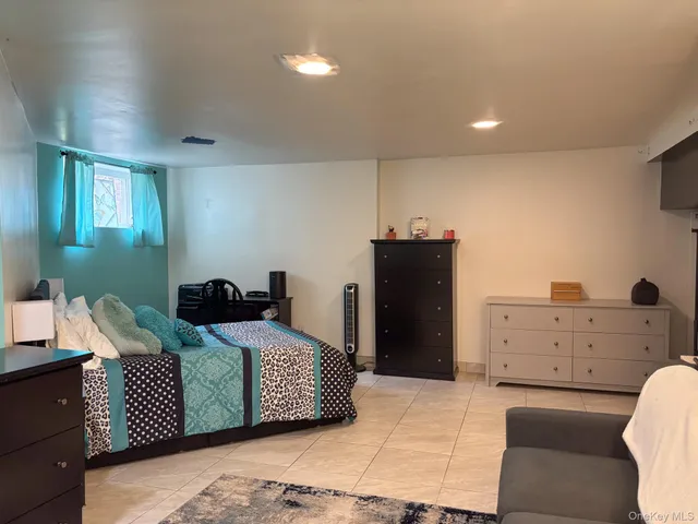 a bedroom with a bed and furniture