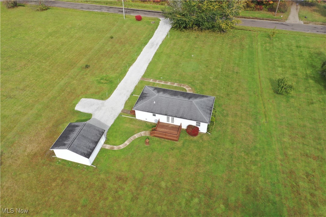 5710 Callahan Road Rome, OH 44085 - Photo 4 of 44 Outdoors, the large, flat yard with mature trees provides a serene backdrop for relaxation. USDA financing—perfect for those seeking affordable rural living.