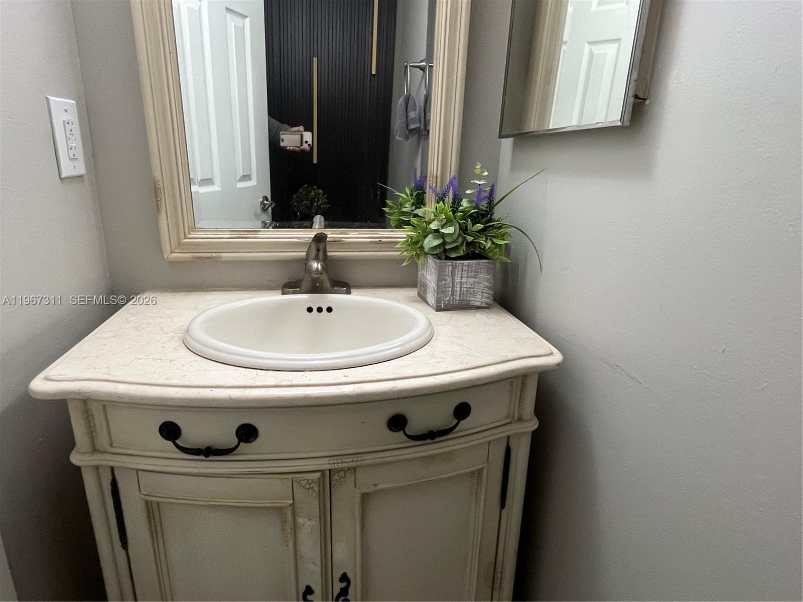 5150 Lake Loop Road Cooper City, FL 33330 - Photo 11 of 22 a sink with a washer and dryer