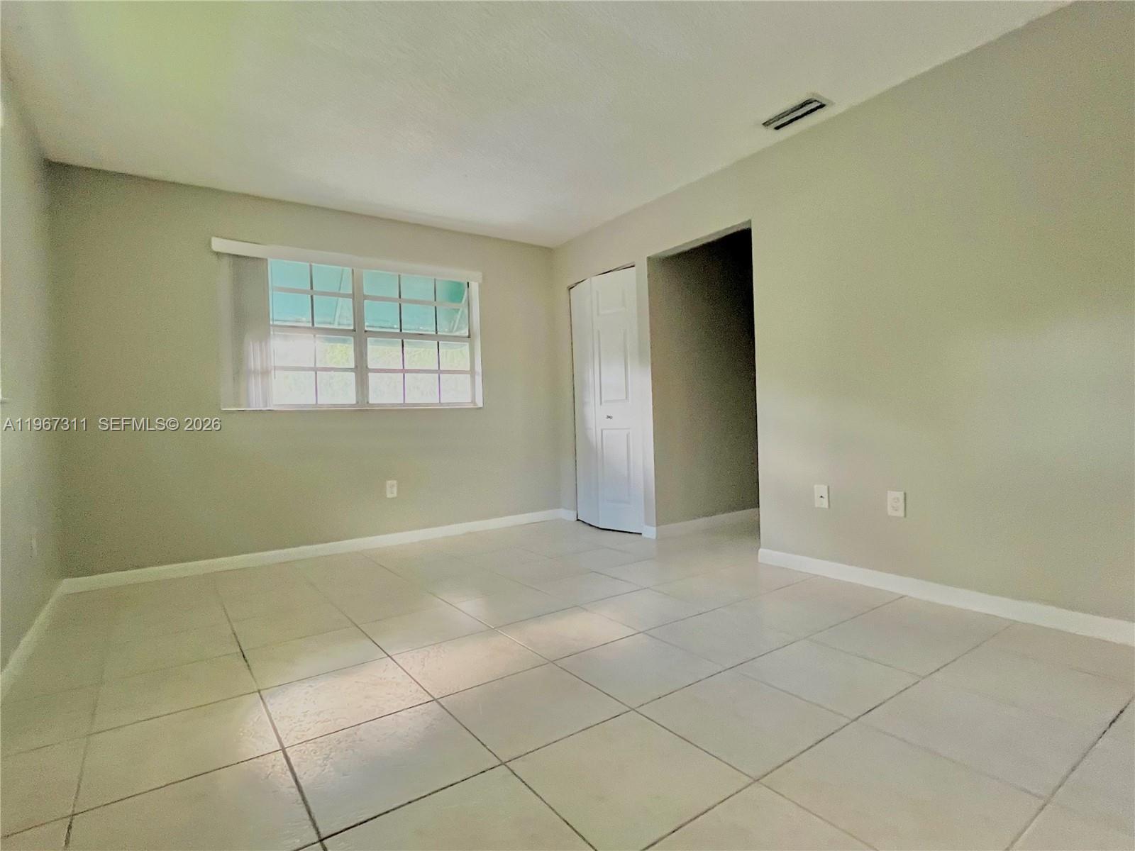 5150 Lake Loop Road Cooper City, FL 33330 - Photo 18 of 22 a view of an empty room with a window