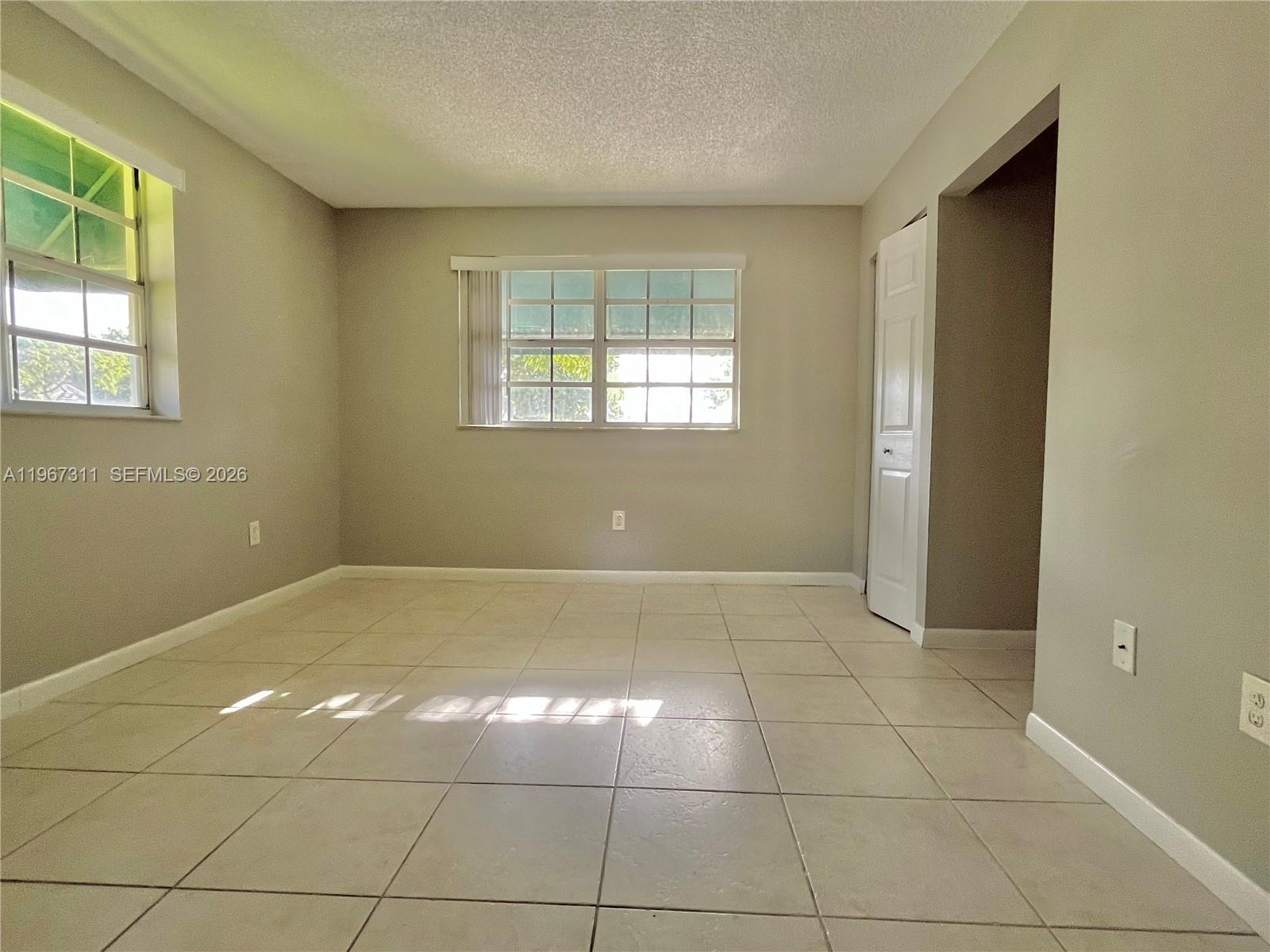 5150 Lake Loop Road Cooper City, FL 33330 - Photo 19 of 22 a view of a livingroom with a window