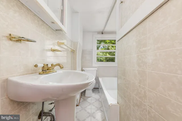 a bathroom with a sink and a bathtub