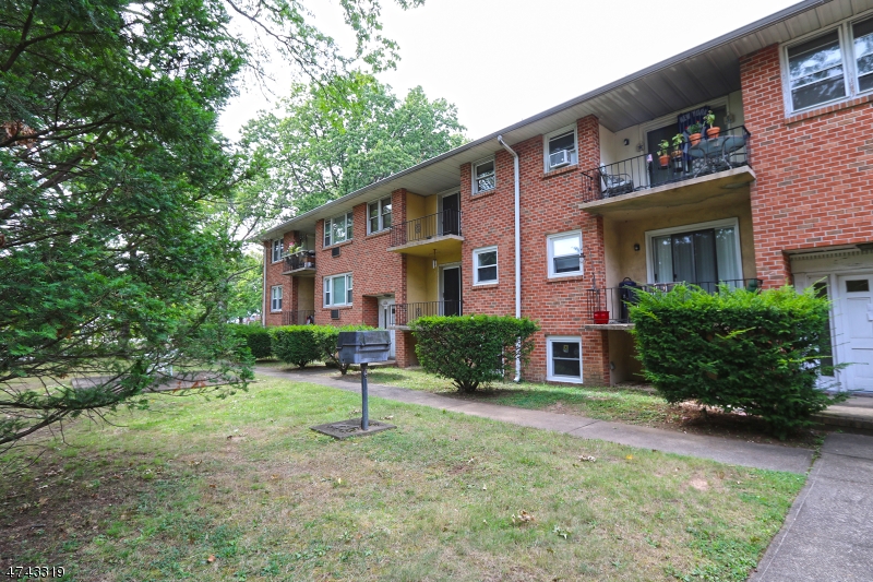 2 Westervelt Place, Unit C203 Clifton, NJ 07011 - Photo 1 of 11 a front view of a house with a yard