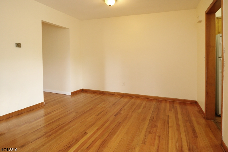 2 Westervelt Place, Unit C203 Clifton, NJ 07011 - Photo 10 of 11 a view of empty room with wooden floor