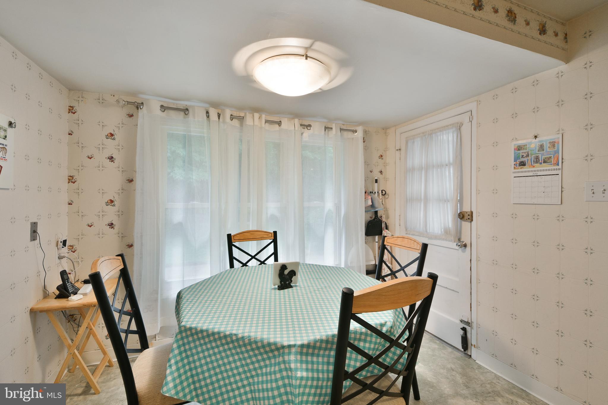 1035 Old Ford Road Huntingdon Valley, PA 19006 - Photo 13 of 39 a bedroom with a bed and a chandelier