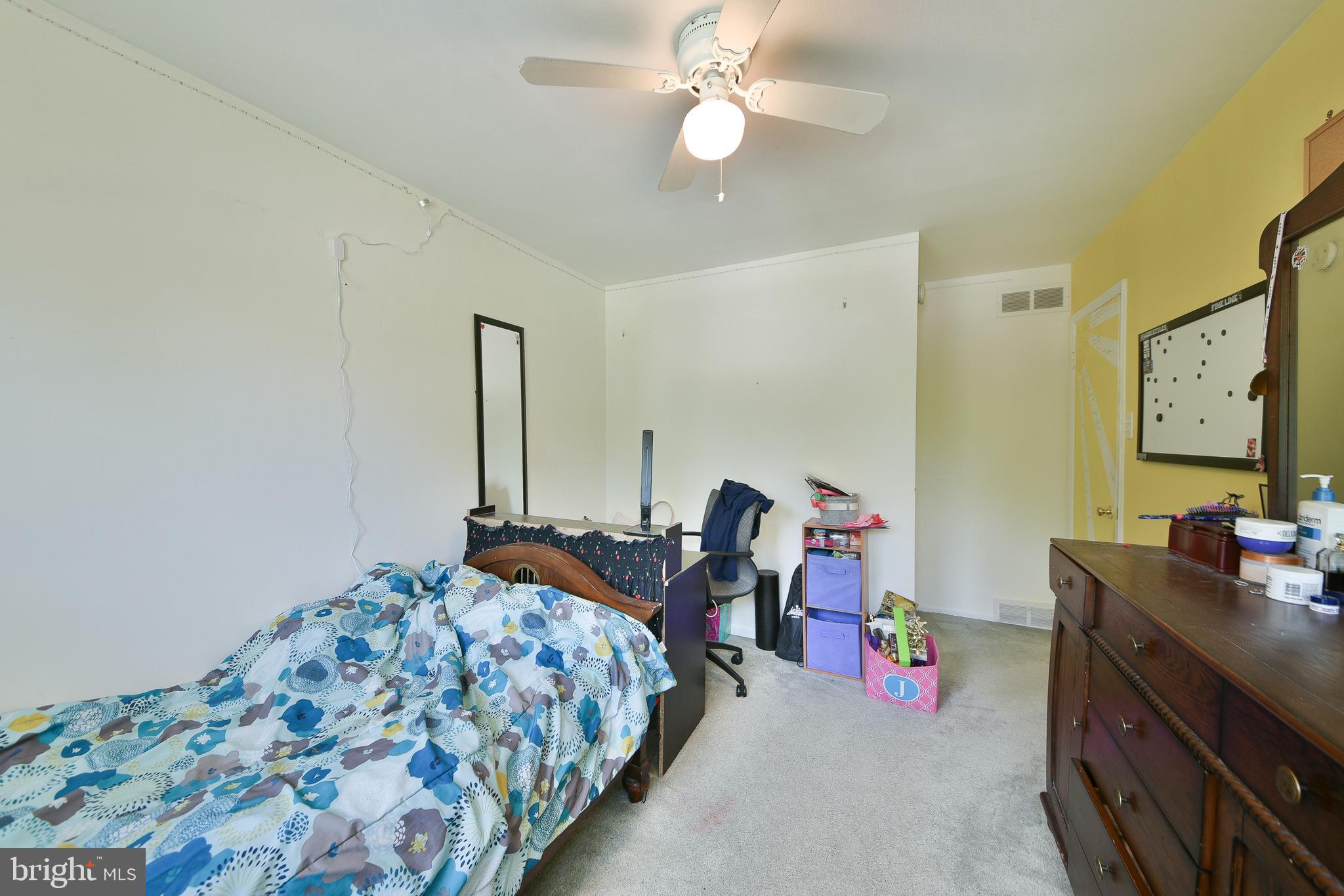 1035 Old Ford Road Huntingdon Valley, PA 19006 - Photo 26 of 39 a bedroom with bed and a chandelier