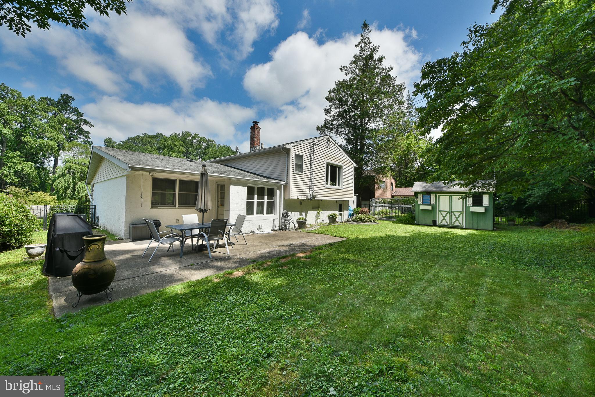 1035 Old Ford Road Huntingdon Valley, PA 19006 - Photo 33 of 39 a view of a house with backyard sitting area and garden