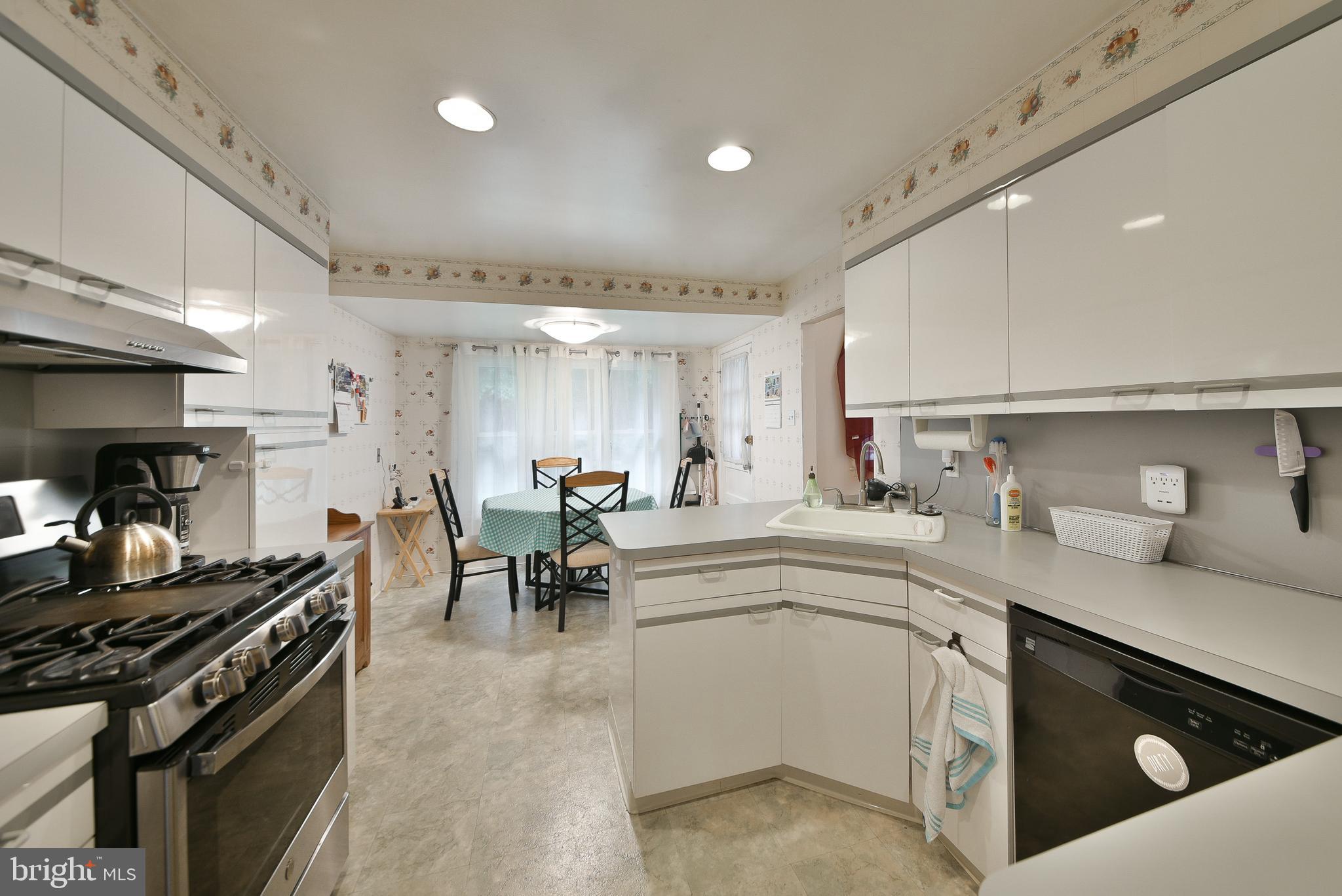 1035 Old Ford Road Huntingdon Valley, PA 19006 - Photo 10 of 39 a kitchen with a sink stove and cabinets