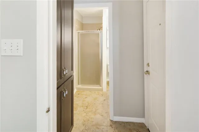 a view of a bathroom from a hallway
