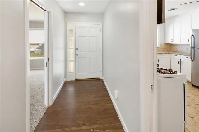 a view of a kitchen from the hallway