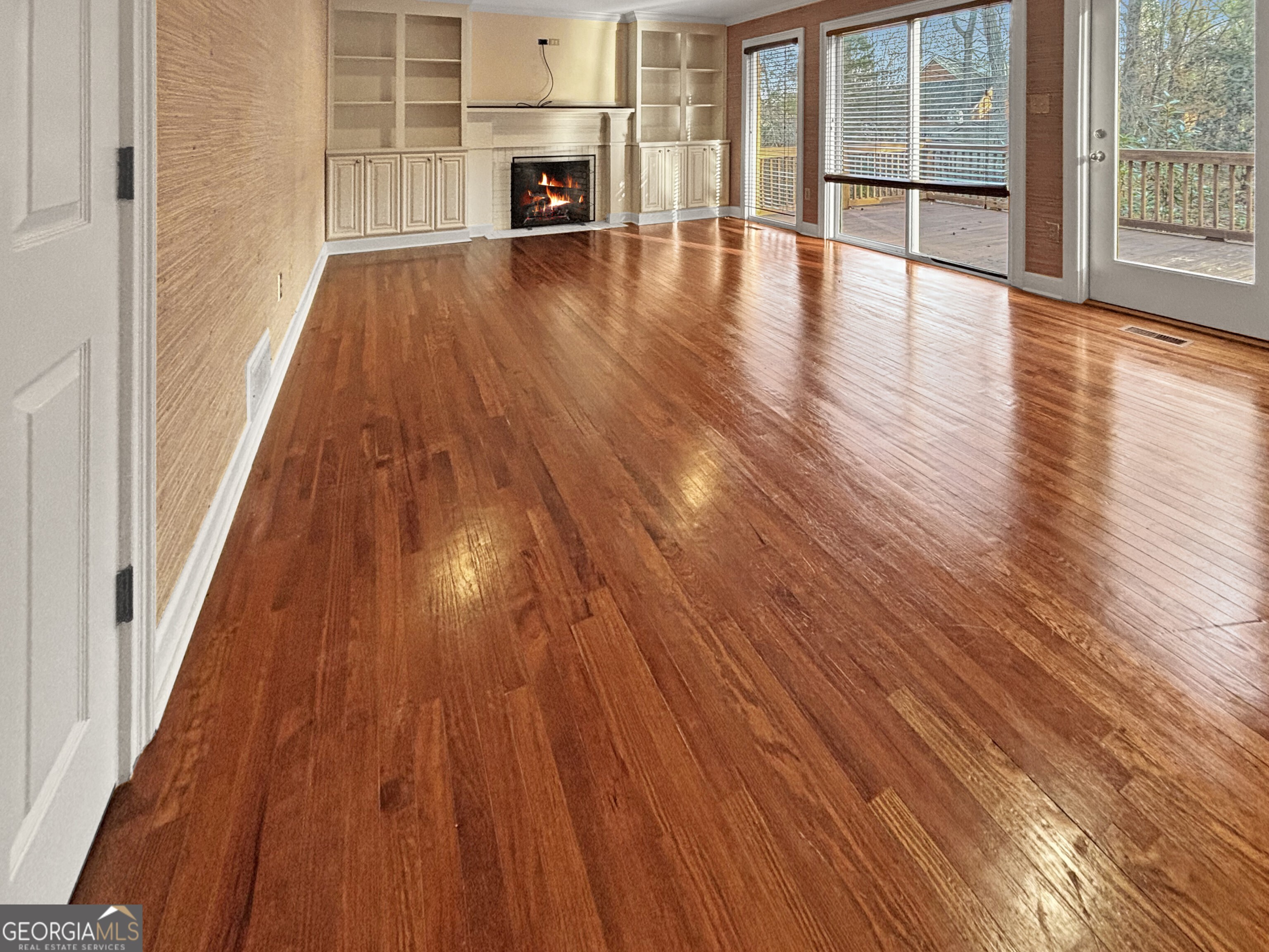 125 Mitchell Bluff Athens, GA 30606 - Photo 11 of 55 a view of an empty room with wooden floor and a window