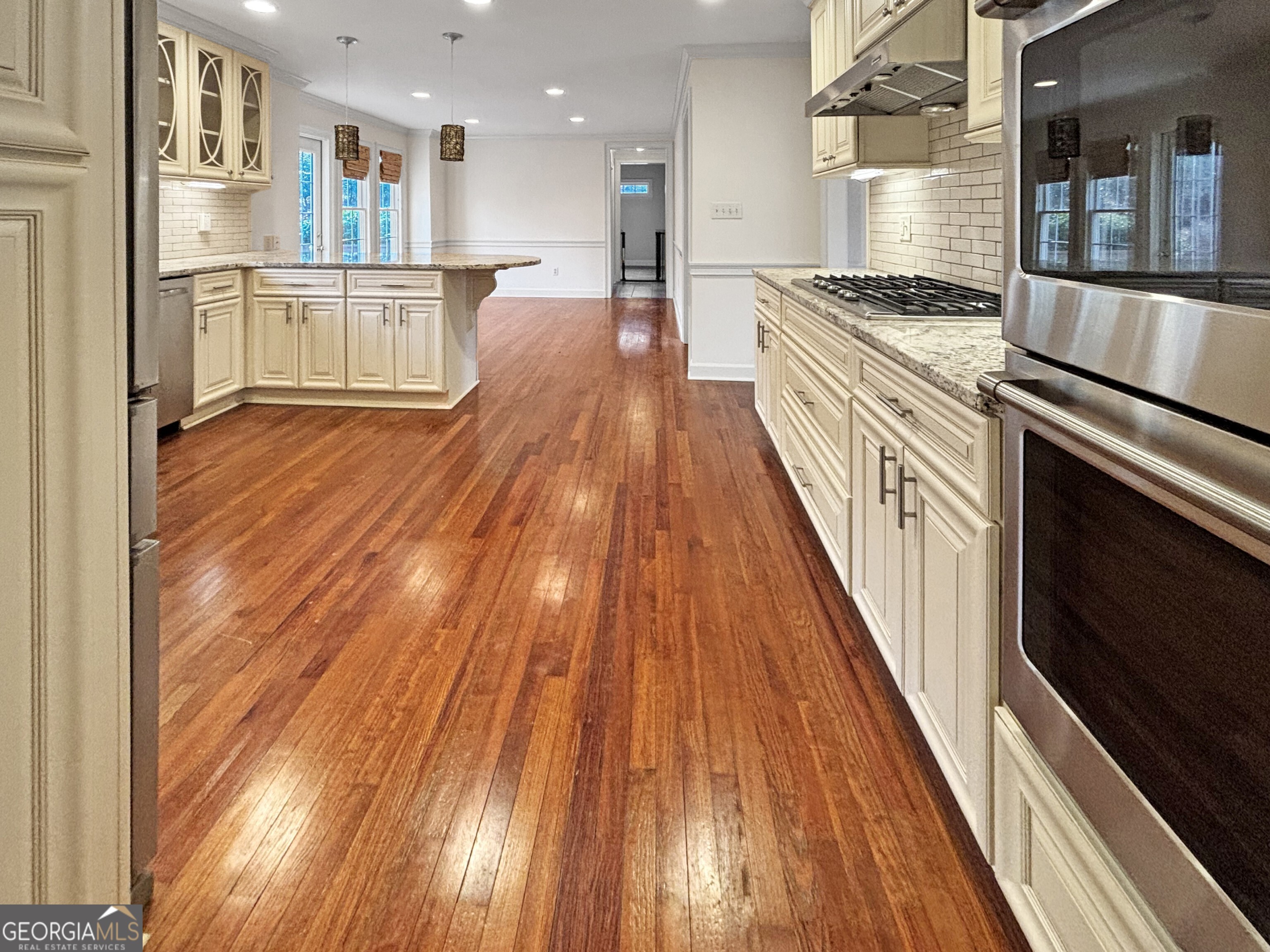 125 Mitchell Bluff Athens, GA 30606 - Photo 15 of 55 a kitchen with stainless steel appliances granite countertop a refrigerator a stove and a wooden floors