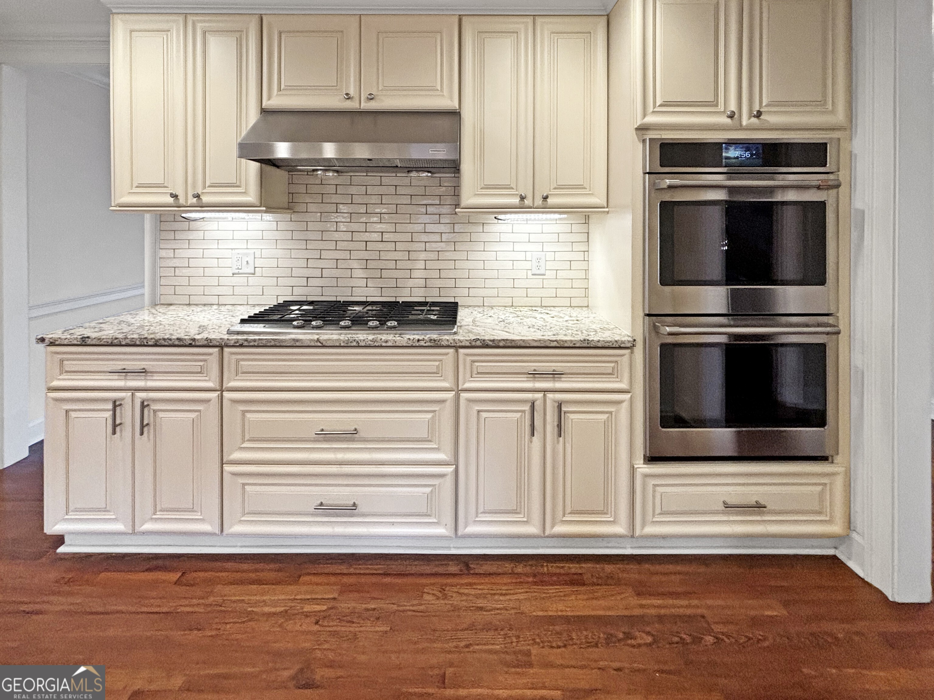 125 Mitchell Bluff Athens, GA 30606 - Photo 18 of 55 a kitchen with granite countertop a stove and a microwave