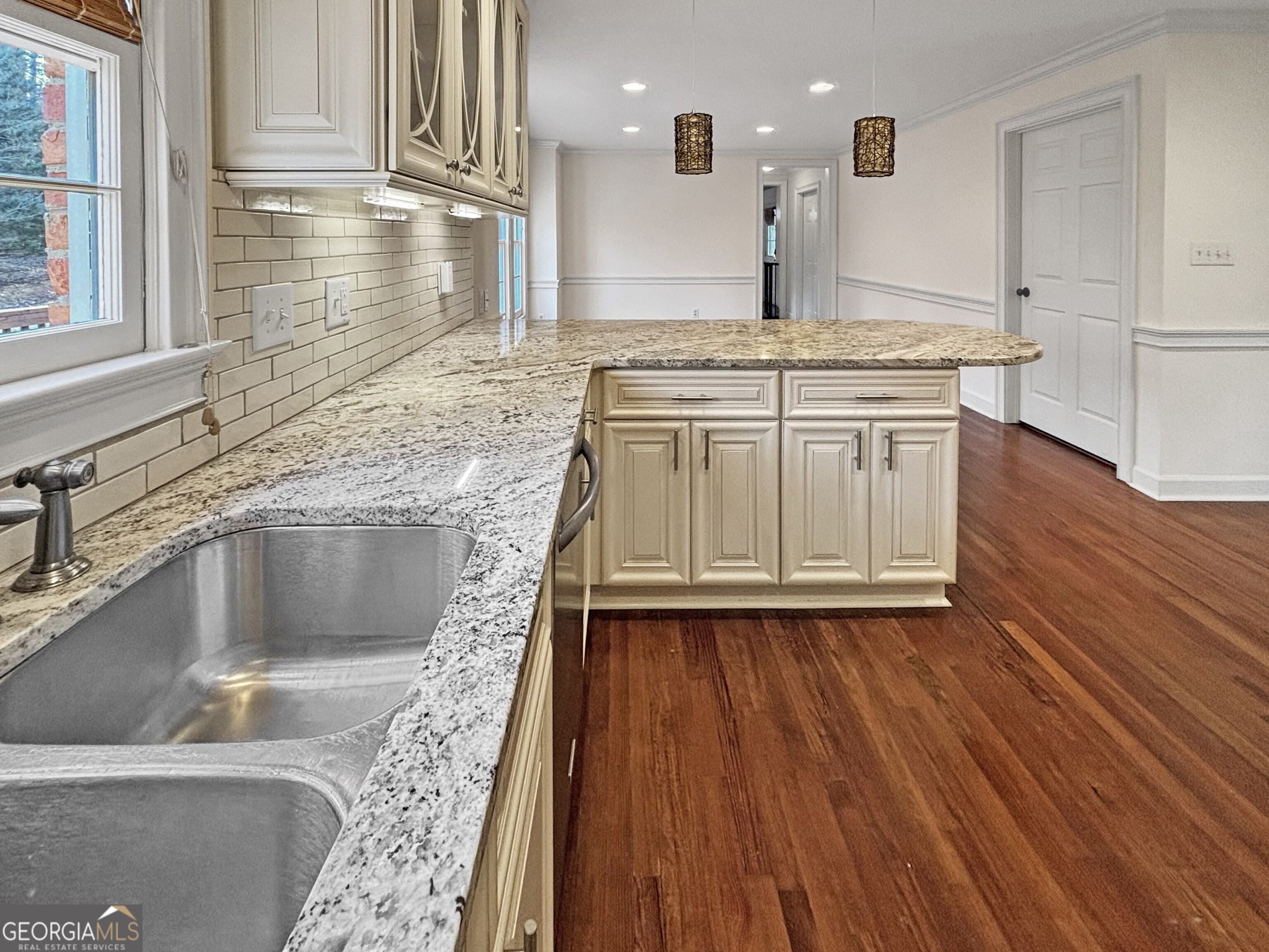 125 Mitchell Bluff Athens, GA 30606 - Photo 19 of 55 a kitchen with granite countertop a sink and a stove top oven
