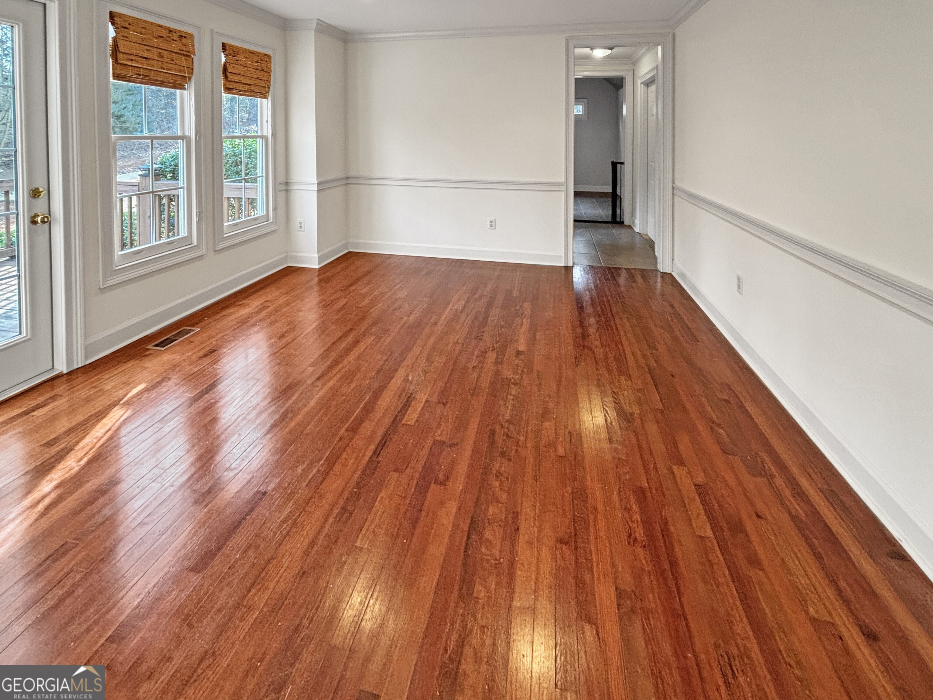 125 Mitchell Bluff Athens, GA 30606 - Photo 21 of 55 a view of empty room with wooden floor and windows