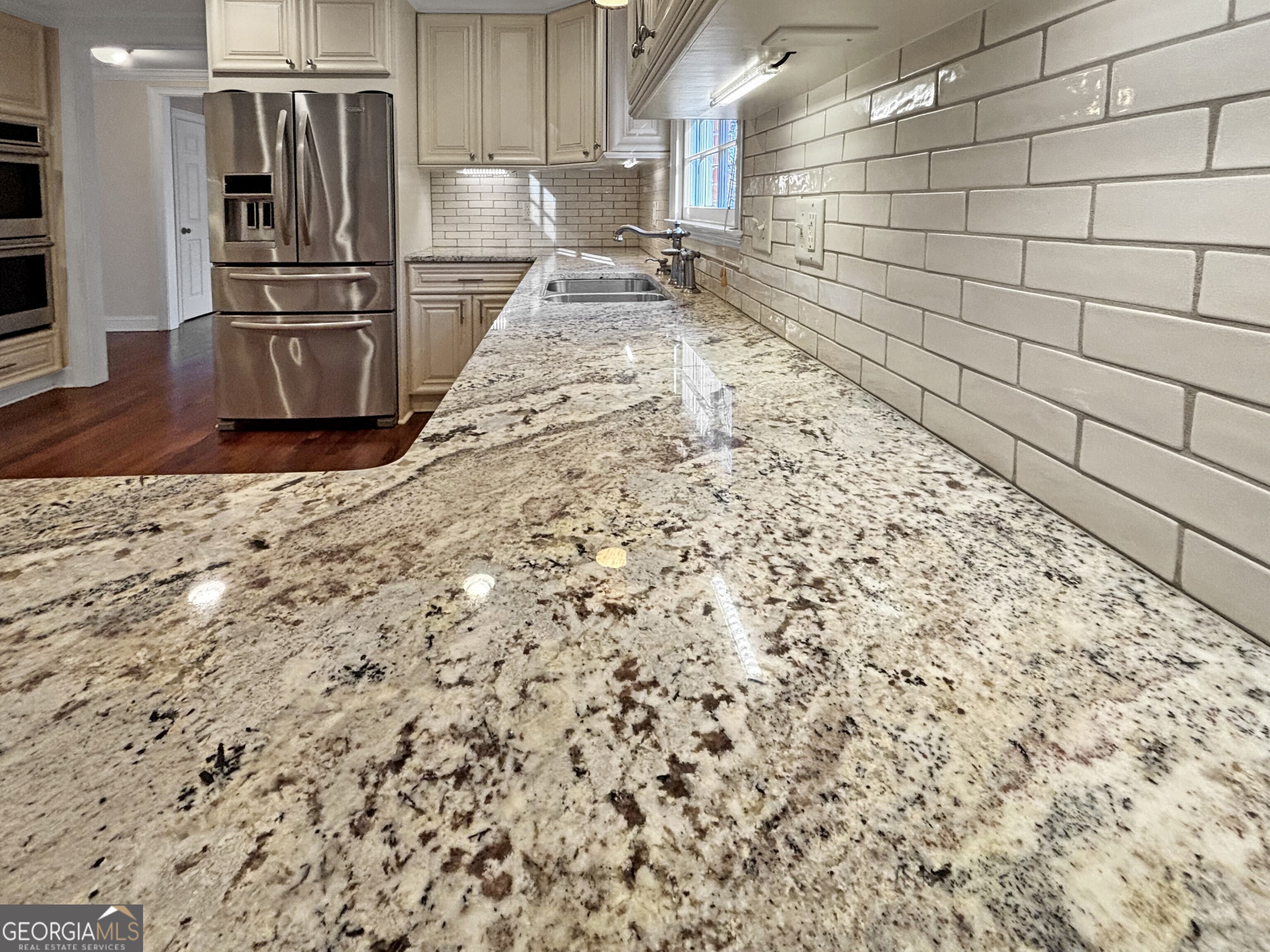 125 Mitchell Bluff Athens, GA 30606 - Photo 22 of 55 a kitchen with granite countertop a refrigerator and a stove