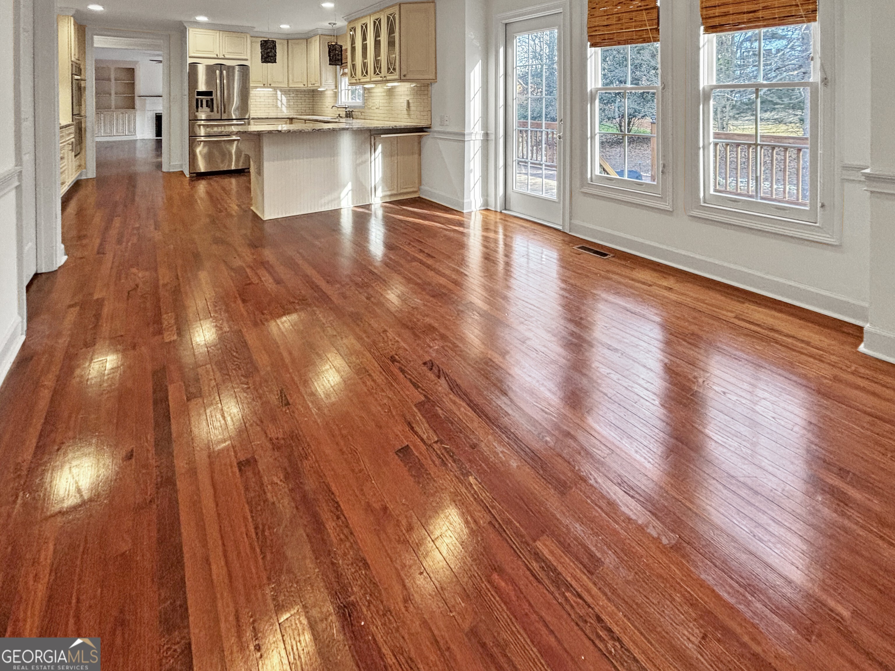 125 Mitchell Bluff Athens, GA 30606 - Photo 25 of 55 a view of open kitchen with wooden floor and windows