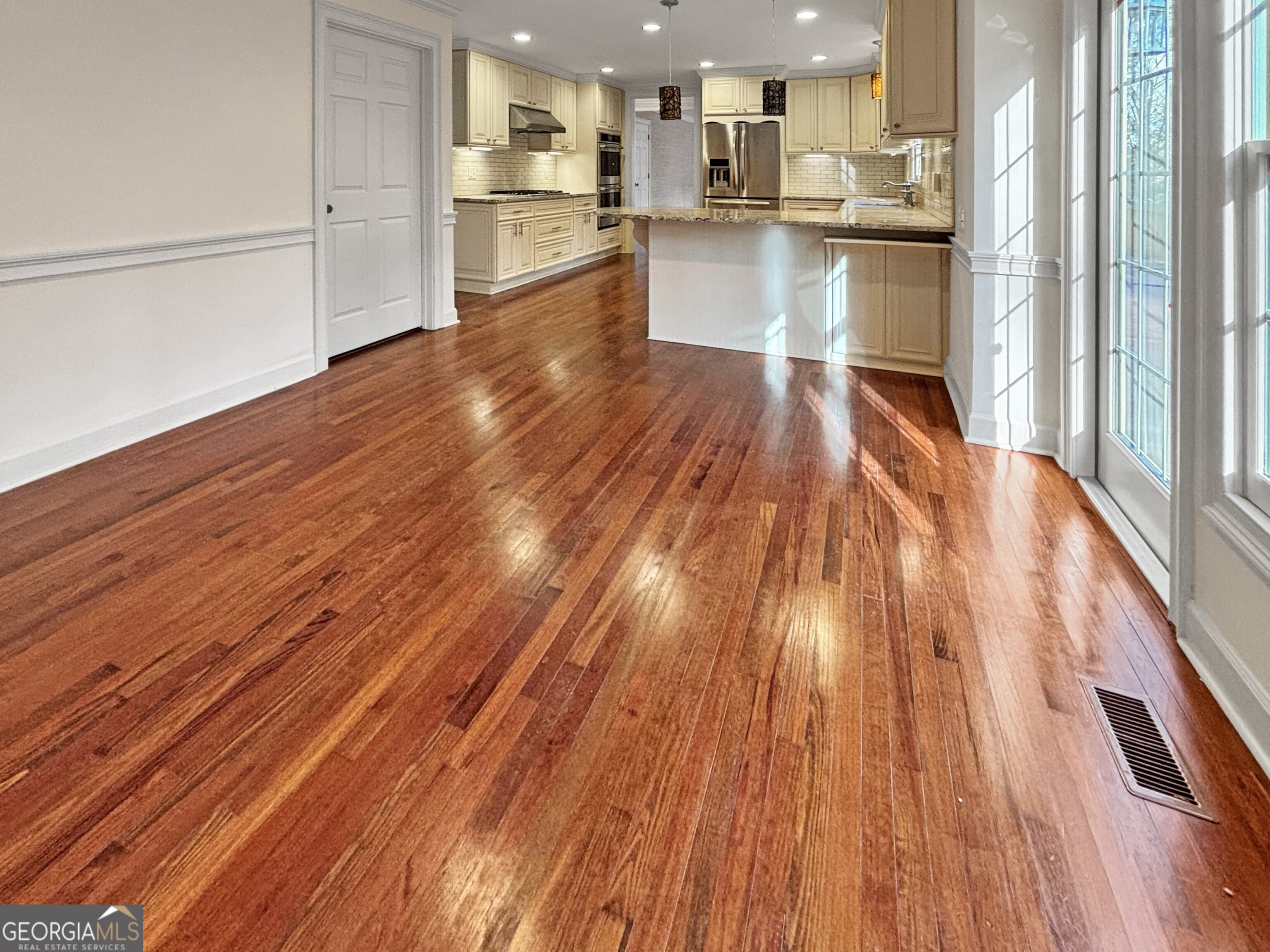 125 Mitchell Bluff Athens, GA 30606 - Photo 26 of 55 a view of a kitchen with wooden floor and electronic appliances