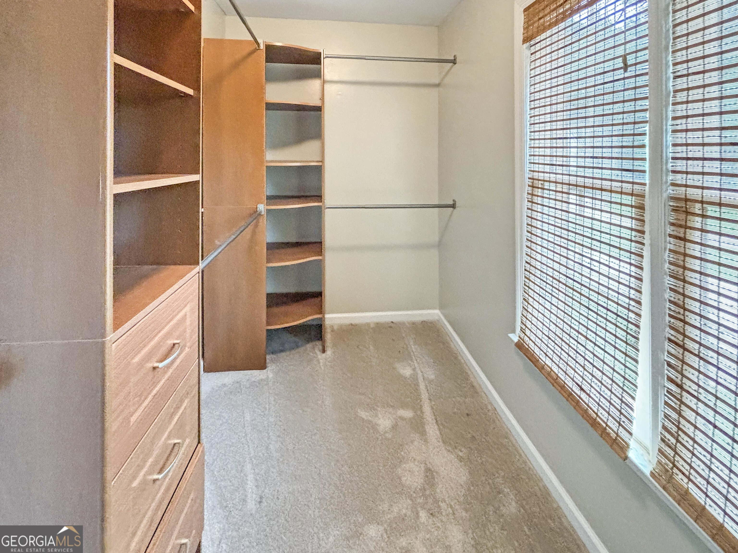 125 Mitchell Bluff Athens, GA 30606 - Photo 35 of 55 a view of walk in closet with empty racks