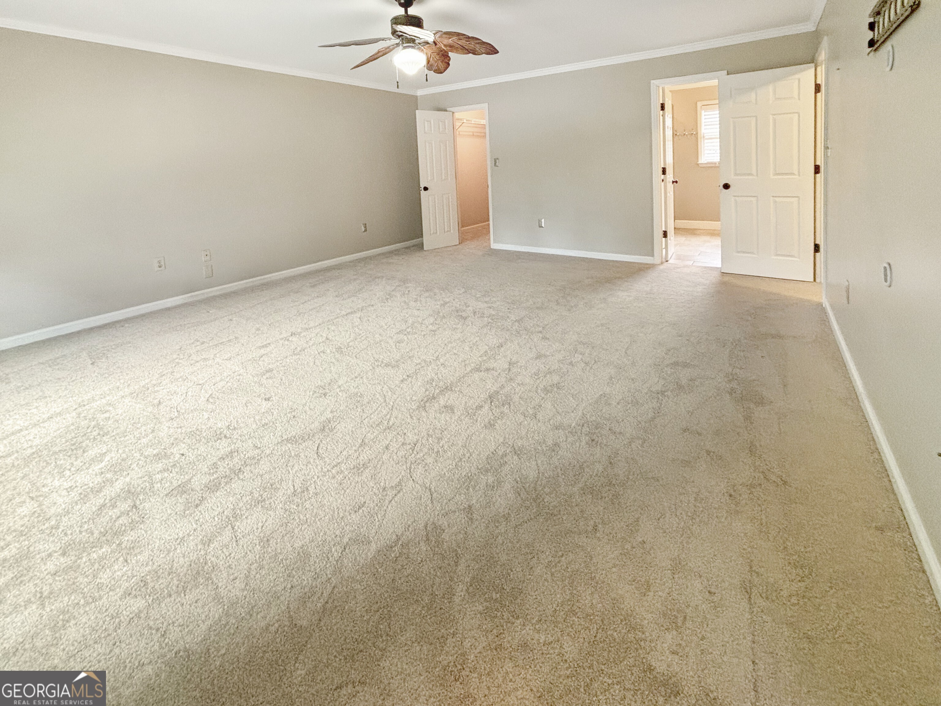 125 Mitchell Bluff Athens, GA 30606 - Photo 36 of 55 en empty room with an entryway and chandelier fan
