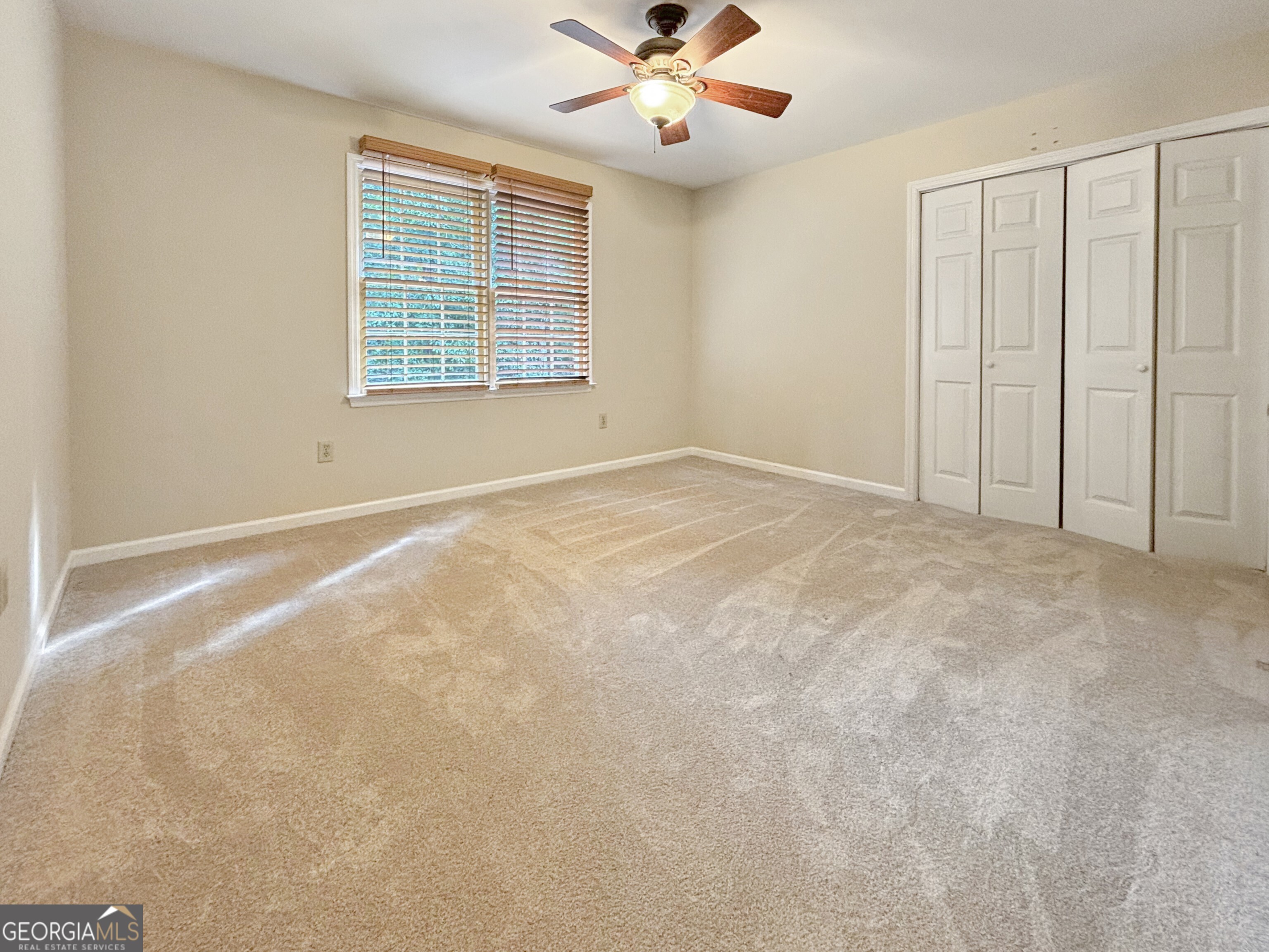 125 Mitchell Bluff Athens, GA 30606 - Photo 38 of 55 an empty room with windows and fan