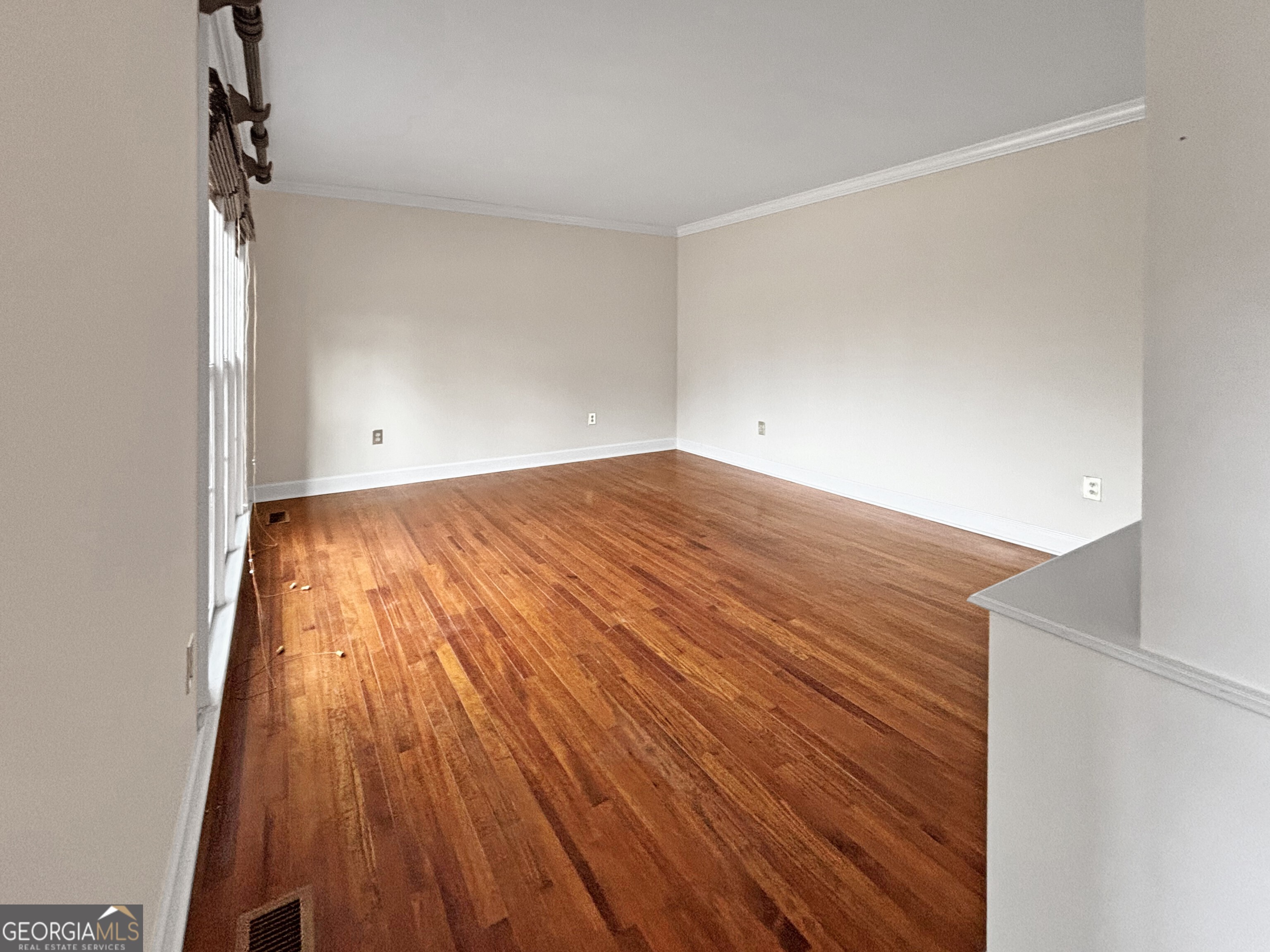 125 Mitchell Bluff Athens, GA 30606 - Photo 8 of 55 a view of an empty room with wooden floor and a window