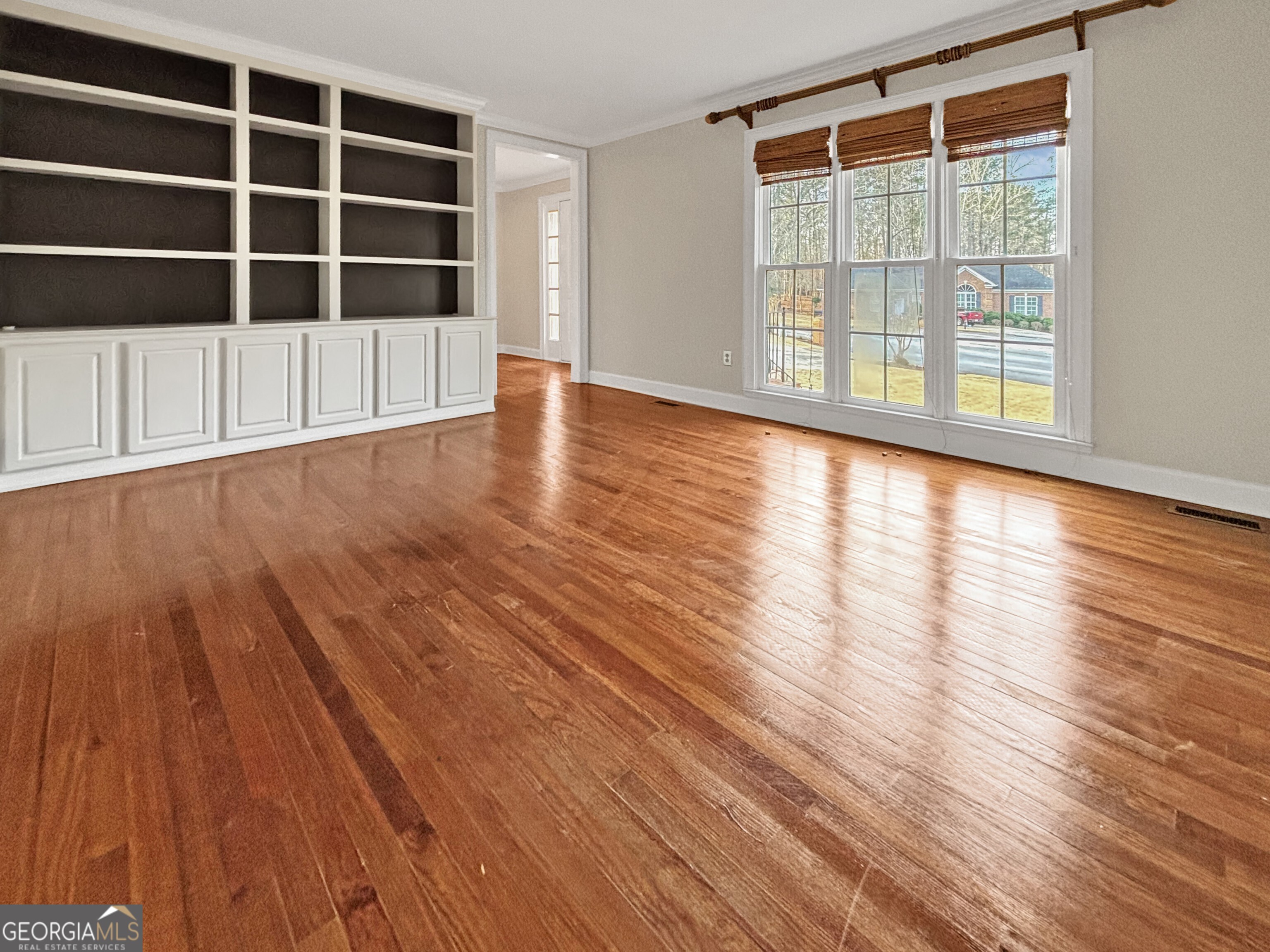 125 Mitchell Bluff Athens, GA 30606 - Photo 9 of 55 a view of an empty room with wooden floor and a window