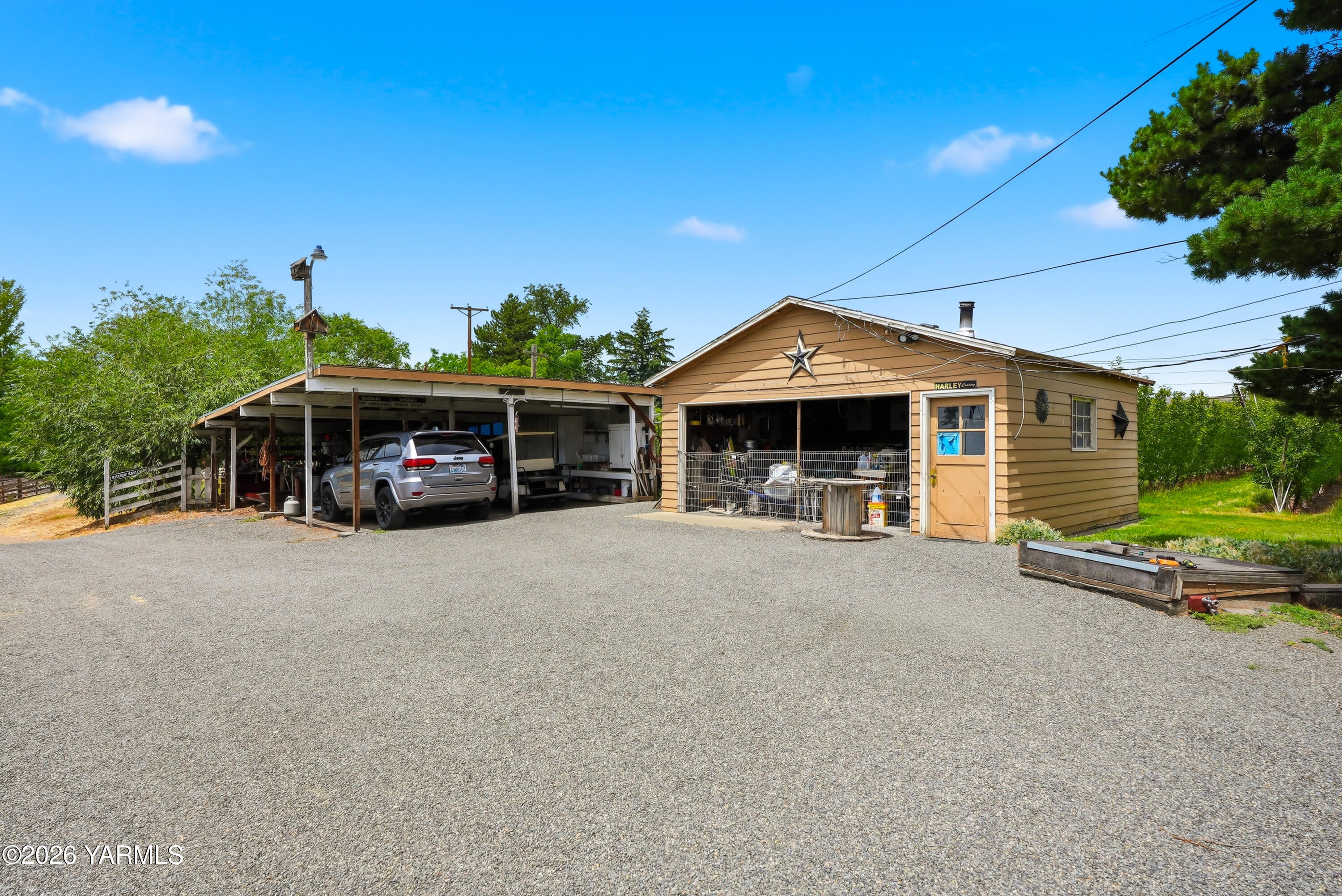690 North Gleed Road Naches, WA 98937 - Photo 32 of 60 a view of a house with a yard and sitting area