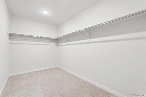 a view of an empty walk in closet