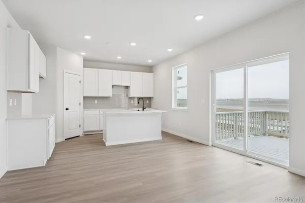 a view of kitchen with wooden floor