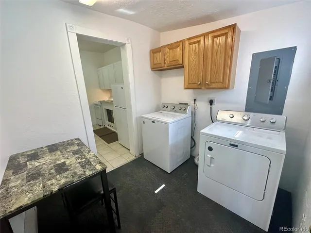 a utility room with a sink a washer and dryer